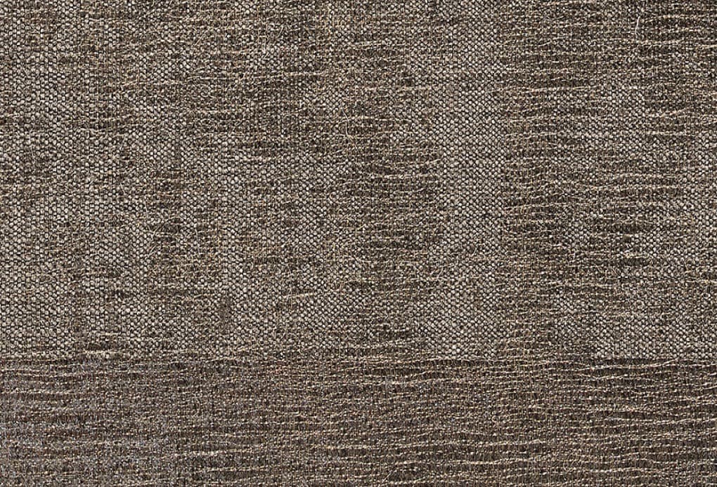 Close-up of a surface with a texture reminiscent of a tightly woven fabric, characterized by a dark brown color and a grainy, irregular finish that creates a shimmering effect.