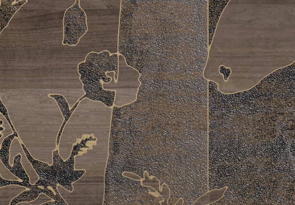 Detail of a surface that combines different textures. A stylized black floral pattern with gold outlines is superimposed on a background that alternates between a dark wood texture and a grainy, shimmering bronze finish. The image is a close-up of the decorative panel.