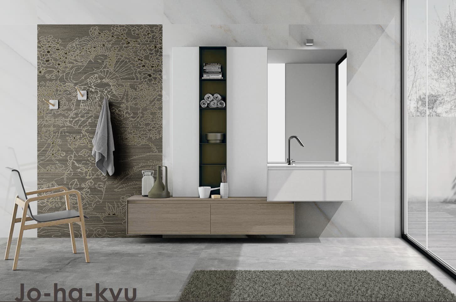 A view of a modern, minimalist bathroom. On the left side, a wall is covered with dark tiles featuring a detailed decorative pattern, with a gray towel hanging. In the center, a light wood wall-mounted vanity unit and a white storage unit with dark open shelves, complete with a chrome faucet. The back and right walls are made of light marble. The bottom of the image shows a concrete floor with a small dark gray rug and a designer wooden chair.